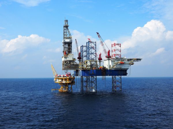 Jack,Up,Drilling,Rig,Operates,Over,Offshore,Wellhead,Platform,With